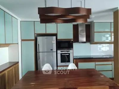 Modern kitchen with sleek cabinetry and stainless steel appliances