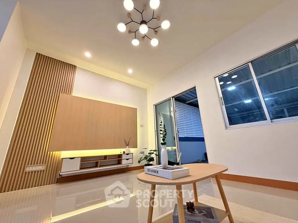 Modern living room with stylish lighting and sleek wooden accents