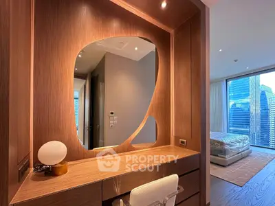 Luxurious bedroom with modern wooden vanity and stunning city view, perfect for urban living.