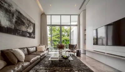 Luxurious modern living room with large windows and stylish decor