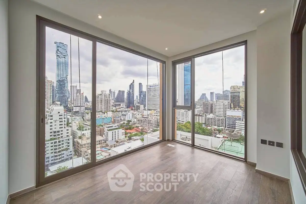 Stunning corner unit with panoramic city views and floor-to-ceiling windows in a modern high-rise.