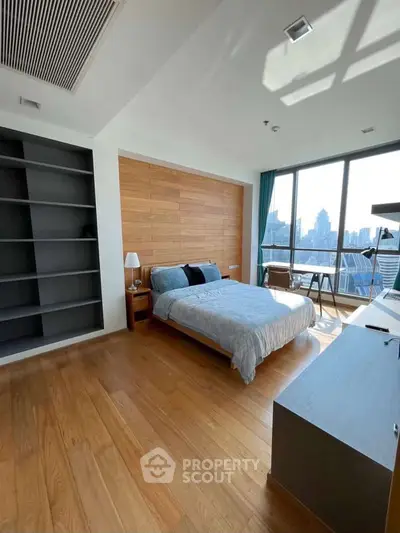 Spacious bedroom with city view and modern design