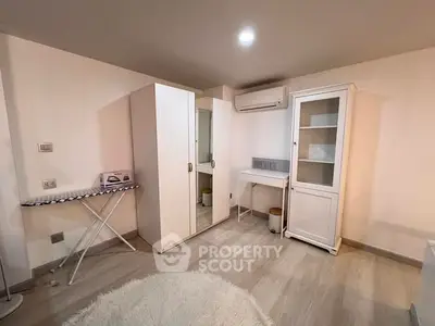 Cozy study room with modern furniture and air conditioning, perfect for productivity and comfort.