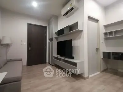 Modern living room with sleek furniture and air conditioning in a stylish apartment.