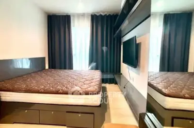 Modern bedroom with sleek design and wall-mounted TV