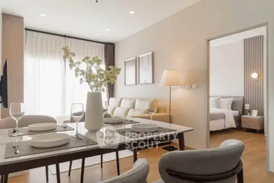 Modern open-plan living and dining area with elegant decor and natural light