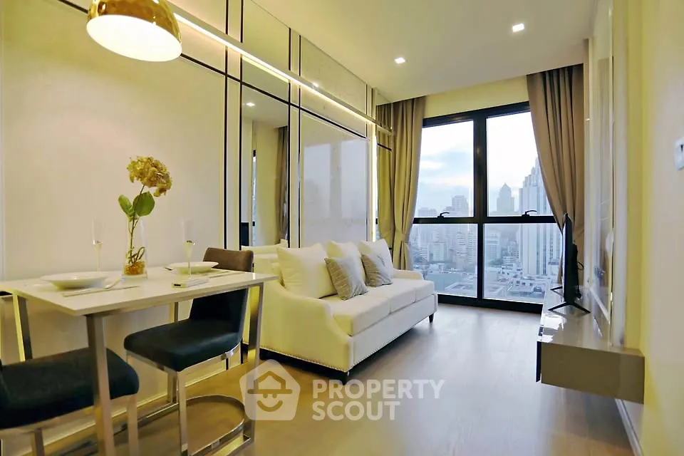 Modern living room with city view, sleek furniture, and elegant decor in a high-rise apartment.