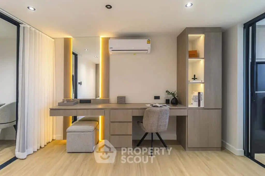 Modern study room with built-in desk, ambient lighting, and air conditioning