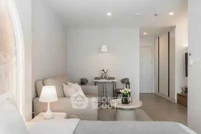Modern open-plan living room with cozy seating and elegant decor