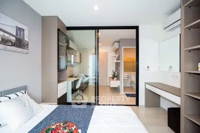 Modern bedroom with sliding glass doors leading to a stylish study area, featuring sleek furniture and bright lighting.