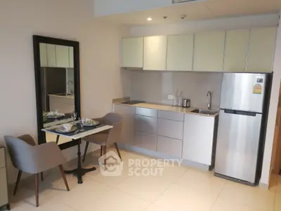 Modern compact kitchen with dining area in stylish apartment