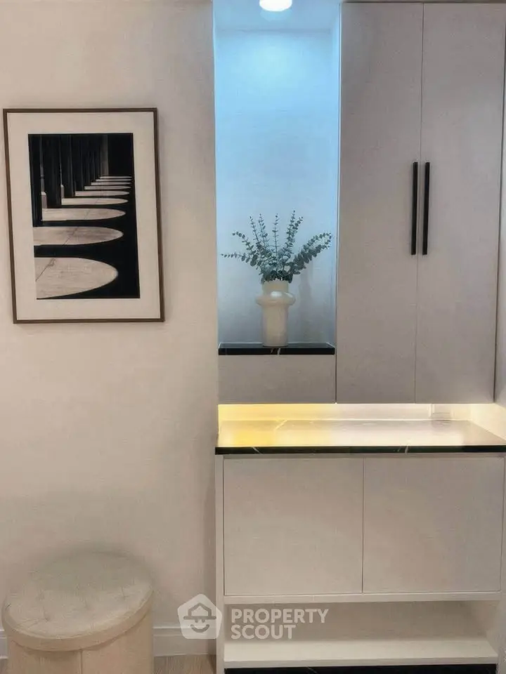 Stylish modern interior with sleek cabinetry and elegant decor in a contemporary home setting.