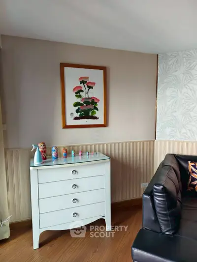 Charming living room corner with elegant chest of drawers and stylish decor