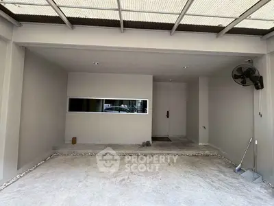 Spacious modern garage with sleek design and ample storage space.