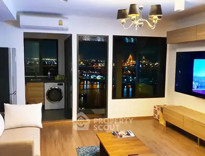 Modern living room with stunning night city view and open kitchen layout