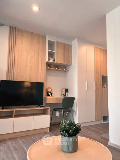 Modern living room with stylish wooden furniture and cozy workspace