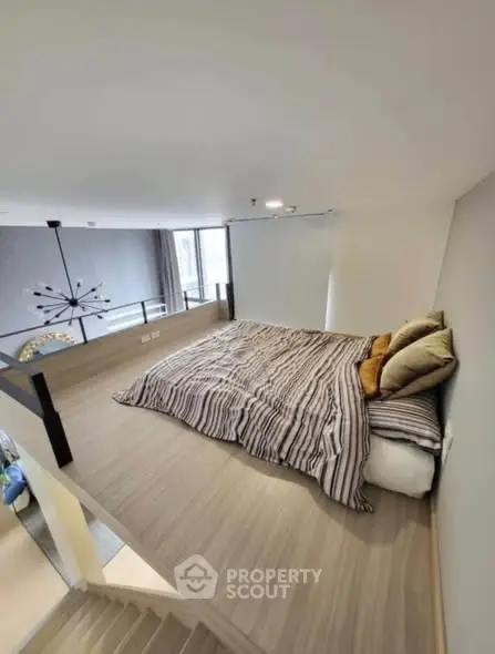 Modern loft bedroom with stylish decor and cozy ambiance