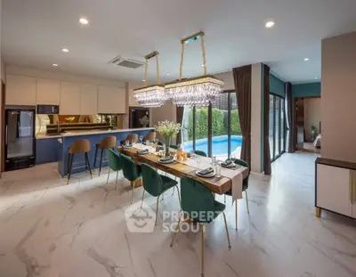 Luxurious open-plan dining area with pool view, elegant chandeliers, and modern kitchen design.