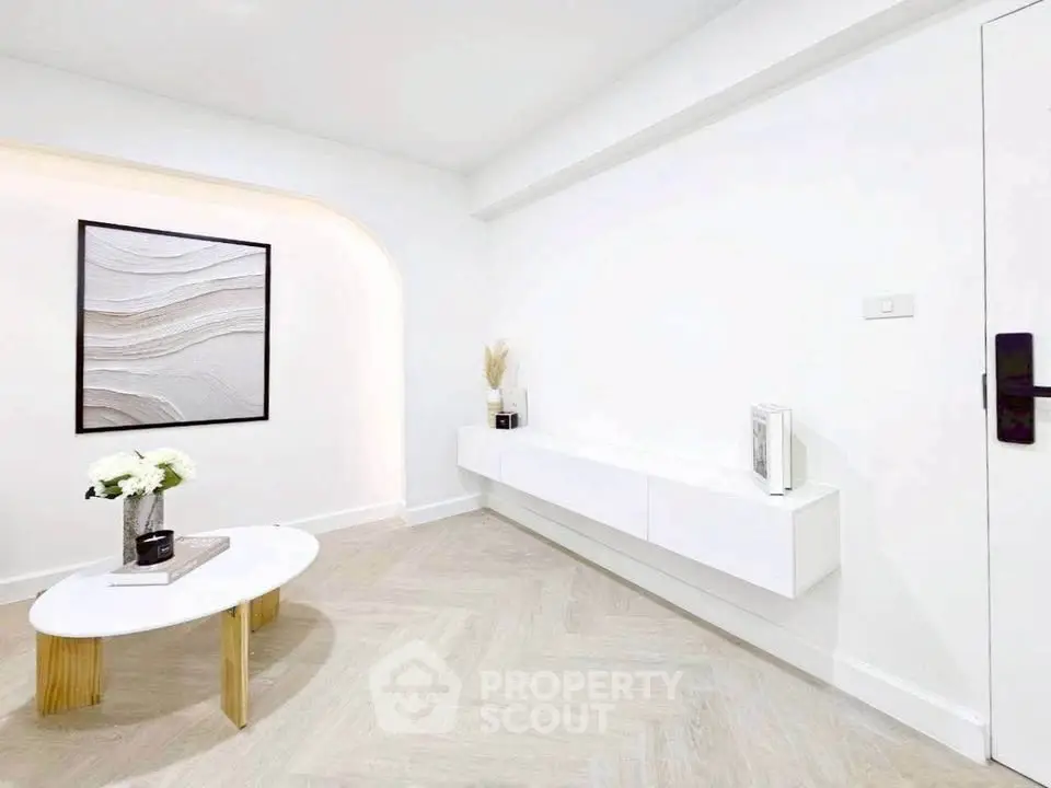 Modern minimalist living room with white decor and stylish coffee table