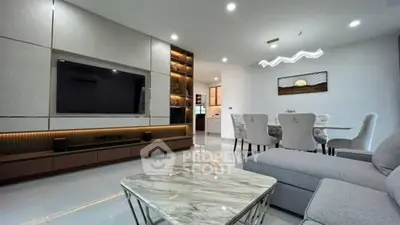 Luxurious modern living room with sleek design and elegant dining area, perfect for contemporary living.