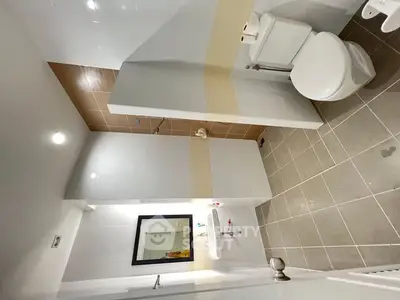 Modern bathroom with sleek tiles and contemporary fixtures