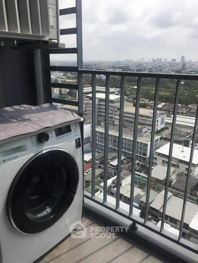 High-rise balcony with washing machine and stunning city view