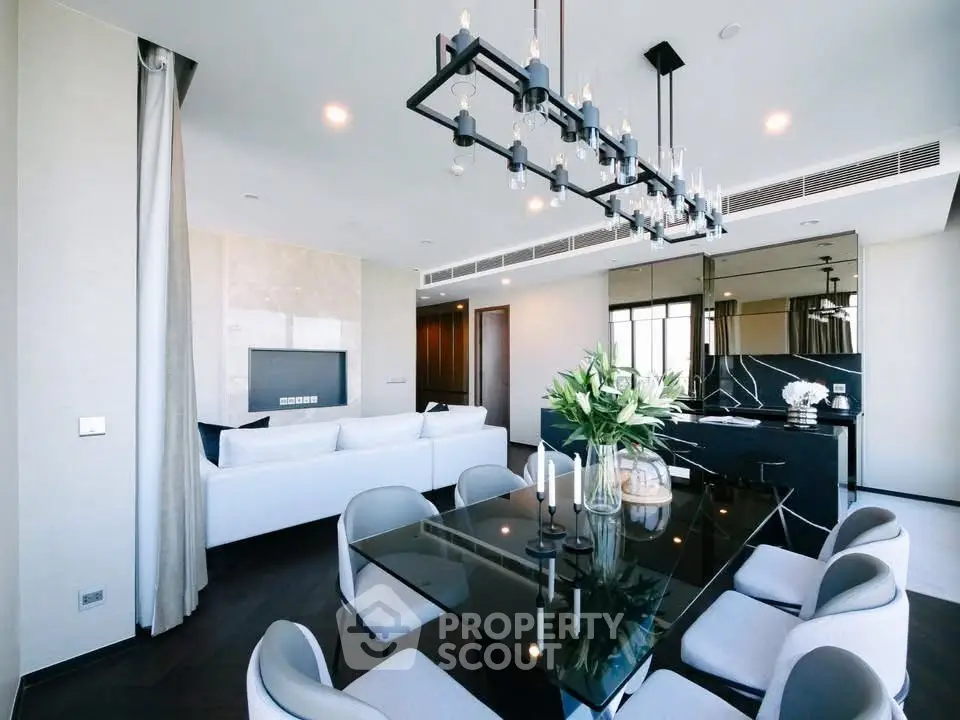 Luxurious modern living room with elegant dining area and stylish chandelier