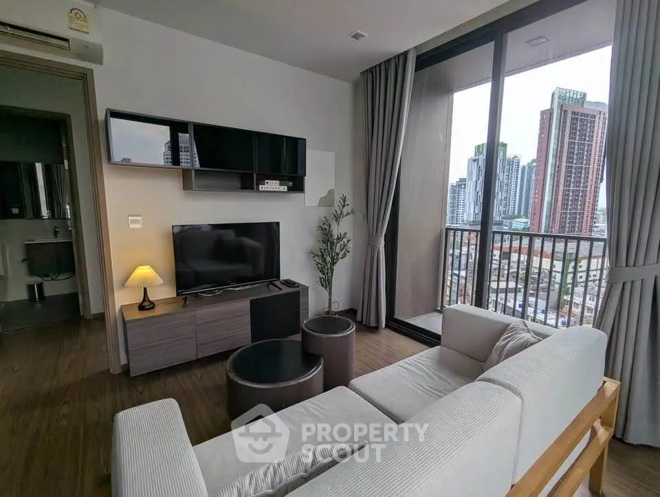 Modern living room with city view balcony in high-rise apartment