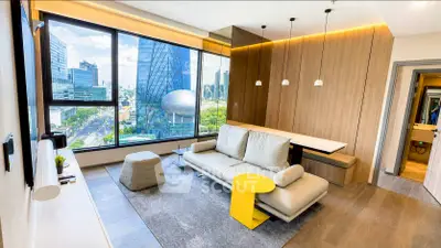 Modern living room with stunning city view and stylish furniture in high-rise apartment.