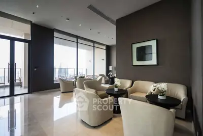 Luxurious modern living room with elegant seating and stunning city view balcony.