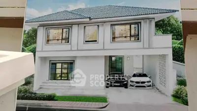 Modern two-story house with sleek design and double garage in a lush green setting.