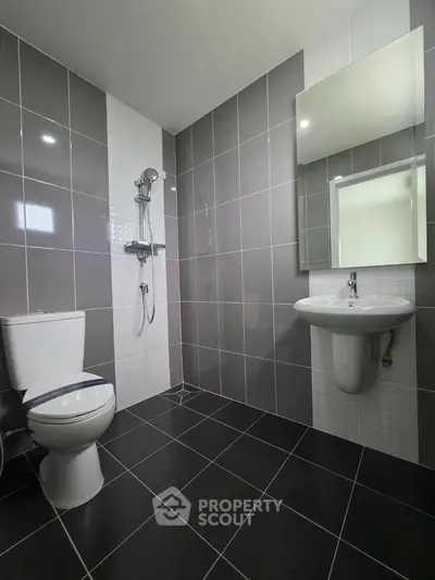 Modern bathroom with sleek tiles and contemporary fixtures