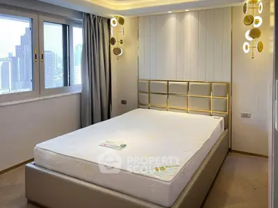 Luxurious bedroom with city view, elegant lighting, and modern decor in high-rise apartment.