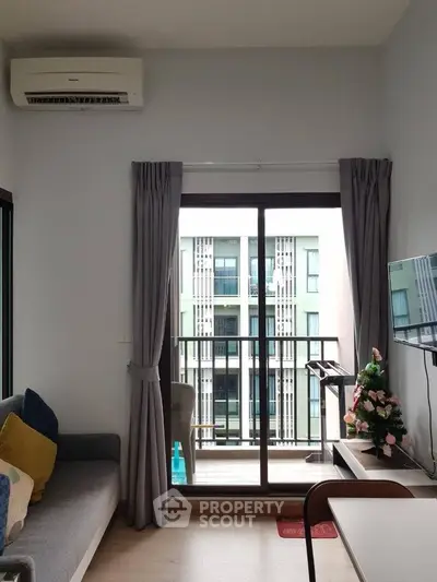 Modern apartment living room with balcony view and stylish decor