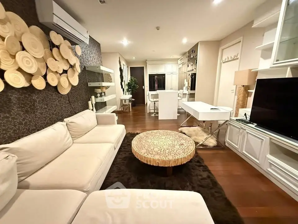 Luxurious living room with modern decor and open layout, featuring elegant furniture and ambient lighting.