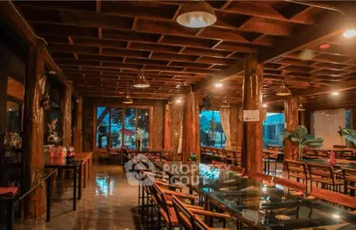 Elegant dining area with wooden decor and glass tables, perfect for gatherings.