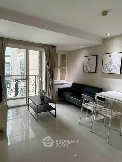 Modern living room with balcony access and stylish decor