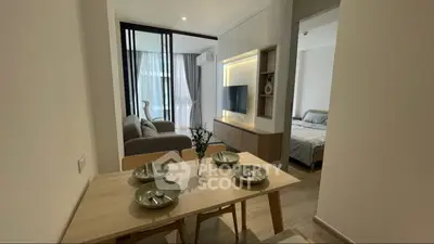 Modern open-plan living and dining area with stylish decor and natural light.
