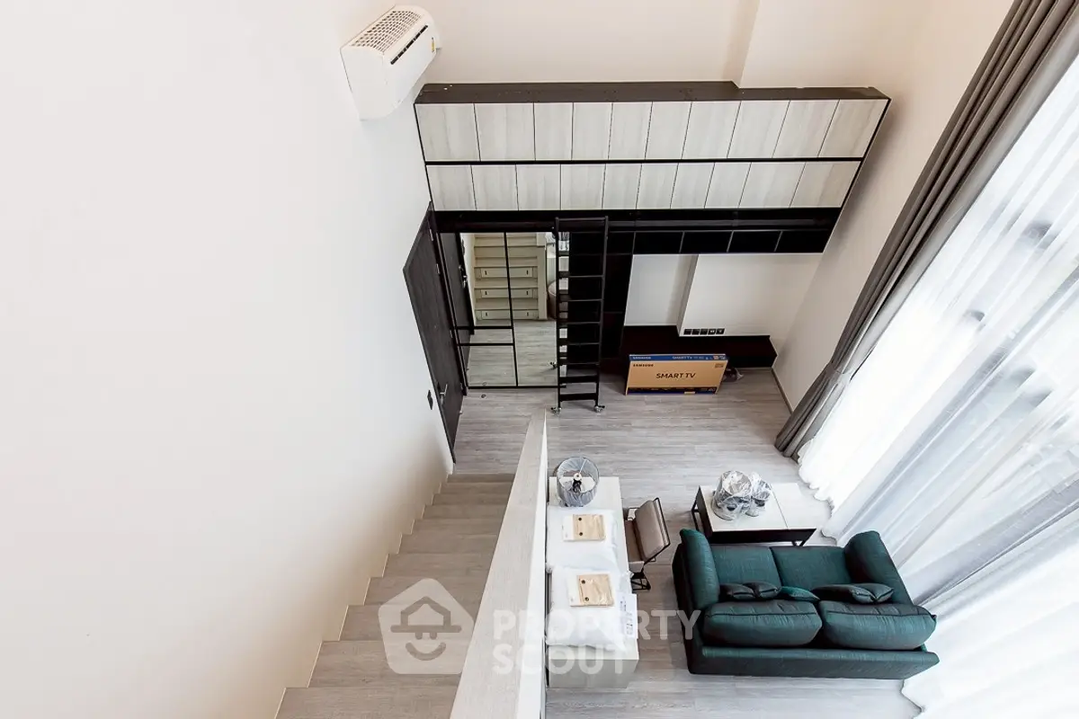 Modern loft apartment with stylish living room and mezzanine storage