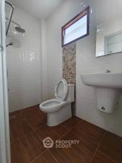Modern bathroom with sleek fixtures and stylish tile design.