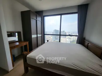 Spacious bedroom with city view in modern apartment