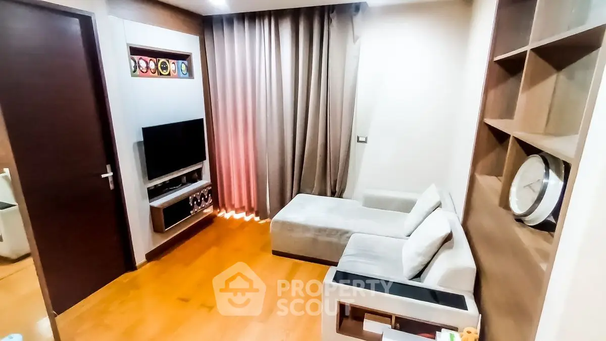 Modern living room with cozy sectional sofa and wall-mounted TV