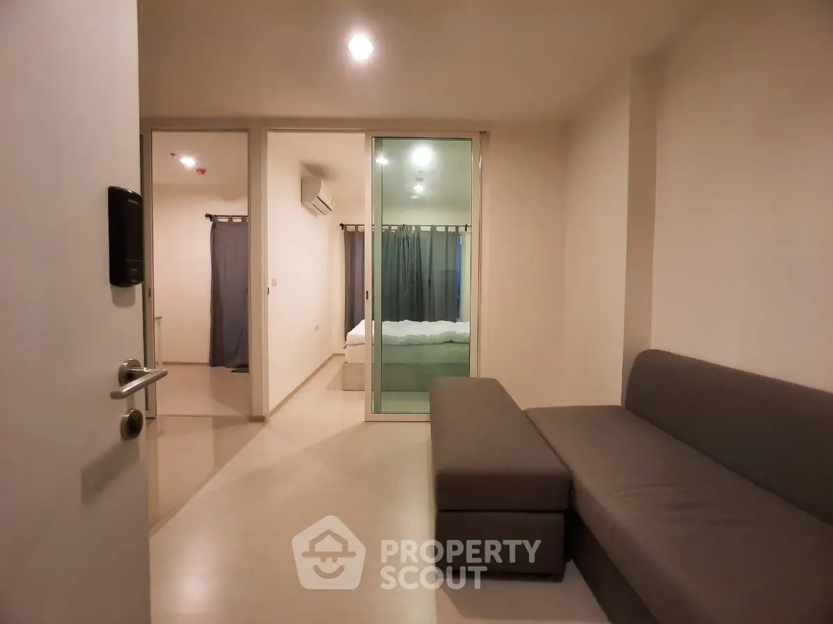 Modern apartment interior with cozy living room and bedroom view