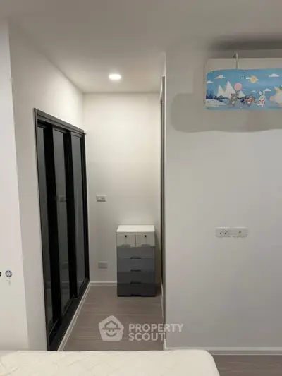 Modern bedroom with sleek design and ample natural light