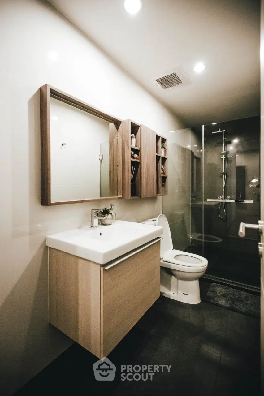 Modern bathroom with sleek design and glass shower enclosure