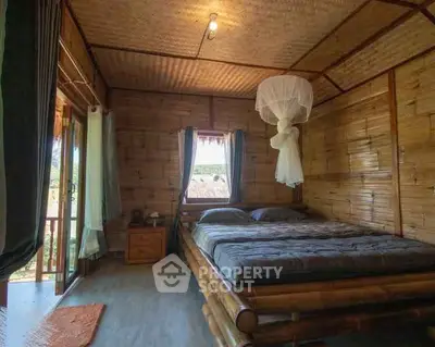 Charming bamboo bedroom with natural light and rustic decor, perfect for a cozy retreat.