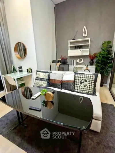 Modern living room with stylish decor and cozy seating area, perfect for relaxation and entertainment.