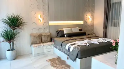 Luxurious modern bedroom with elegant decor and ambient lighting