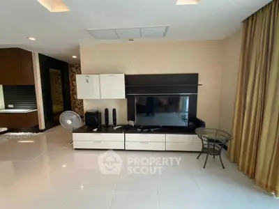 Spacious modern living room with sleek entertainment unit and elegant decor