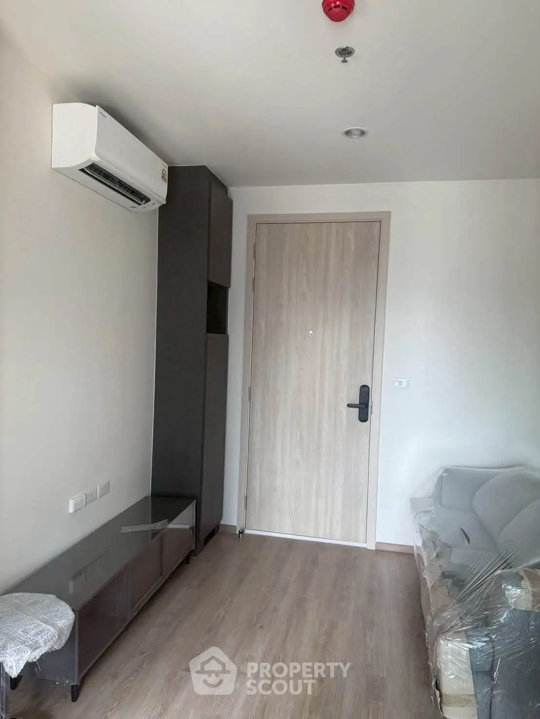 Modern apartment interior with air conditioning and stylish furniture